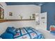 Bedroom featuring custom wall decor, ceiling fan and natural light from the window at 503 Meadow Pointe Dr, Haines City, FL 33844