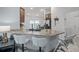 Modern kitchen with granite countertops, a breakfast bar, and stainless steel appliances at 503 Meadow Pointe Dr, Haines City, FL 33844