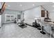 Open-concept living room with tile flooring and ample natural light at 503 Meadow Pointe Dr, Haines City, FL 33844