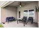 Cozy covered patio with comfortable seating, perfect for outdoor relaxation and entertaining at 503 Meadow Pointe Dr, Haines City, FL 33844