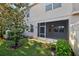 View of the backyard with a covered lanai and privacy fence at 585 Cruz Bay Cir, Winter Springs, FL 32708