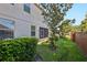 A view of the side yard showing the lanai and privacy fence at 585 Cruz Bay Cir, Winter Springs, FL 32708