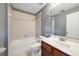 Neutral bathroom features a shower-tub combo and dark wood vanity at 585 Cruz Bay Cir, Winter Springs, FL 32708