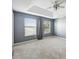 Bedroom with large windows, trey ceiling, fan, and neutral carpet for a bright and airy feel at 585 Cruz Bay Cir, Winter Springs, FL 32708