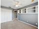 Bedroom with built-in shelving, ceiling fan, neutral carpet, and closet for ample storage at 585 Cruz Bay Cir, Winter Springs, FL 32708