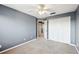 Spacious bedroom with neutral carpet, closet, and ceiling fan for comfortable living at 585 Cruz Bay Cir, Winter Springs, FL 32708