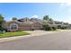 Charming exterior view showcasing a row of townhomes, each with a two-car garage and manicured landscaping at 585 Cruz Bay Cir, Winter Springs, FL 32708