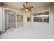 The covered lanai boasts a ceiling fan and sliding glass doors to the interior at 585 Cruz Bay Cir, Winter Springs, FL 32708