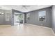 Large living room featuring tile floors, neutral colored walls, a ceiling fan, and sliding glass doors leading to the patio at 585 Cruz Bay Cir, Winter Springs, FL 32708