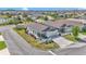 Beautiful home showcasing manicured landscaping, a charming picket fence, and a paved driveway at 6223 Atkinson Ln, The Villages, FL 32163