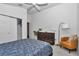 Bedroom with ample natural light, ceiling fan, and closet space at 6223 Atkinson Ln, The Villages, FL 32163