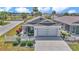 Charming one story home with inviting curb appeal, manicured landscaping, and a two-car garage at 6223 Atkinson Ln, The Villages, FL 32163