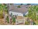 Dalton Villas property exterior showcases well-maintained landscaping and a sign at 6223 Atkinson Ln, The Villages, FL 32163