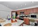 Kitchen area featuring granite counters, stainless steel appliances and an adjacent workspace at 6223 Atkinson Ln, The Villages, FL 32163
