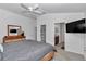 Spacious main bedroom features a large closet, ensuite bathroom, and modern furnishings at 6223 Atkinson Ln, The Villages, FL 32163