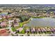 Beautiful aerial view of a lakeside community with single-Gathering homes and lush green landscaping at 634 Via Corso Ct, Kissimmee, FL 34759