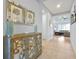 Inviting foyer featuring elegant decor, tiled flooring, and a view into the living room at 634 Via Corso Ct, Kissimmee, FL 34759