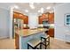 Modern kitchen featuring stainless steel appliances, a central island, and ample cabinet space at 634 Via Corso Ct, Kissimmee, FL 34759