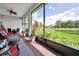 Spacious patio with scenic lake view, ceiling fan, and comfortable seating at 634 Via Corso Ct, Kissimmee, FL 34759
