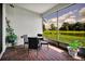 Screened patio with a lake view features a table and seating for four at 634 Via Corso Ct, Kissimmee, FL 34759