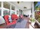 Outdoor patio with red furniture and ceiling fans is perfect for relaxing or entertaining at 634 Via Corso Ct, Kissimmee, FL 34759