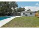 Sparkling pool and expansive backyard offer endless opportunities for outdoor fun and relaxation at 641 Peachwood Dr, Altamonte Springs, FL 32714