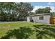 Lush backyard with a pool offers a serene retreat for relaxation and outdoor activities at 641 Peachwood Dr, Altamonte Springs, FL 32714
