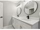Bathroom featuring dual sinks with modern faucets and a white vanity at 641 Peachwood Dr, Altamonte Springs, FL 32714