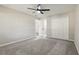 Bedroom featuring gray carpet, neutral walls, a closet, and a ceiling fan at 641 Peachwood Dr, Altamonte Springs, FL 32714