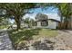 Charming single-story home with black shutters, manicured landscaping and mature trees at 641 Peachwood Dr, Altamonte Springs, FL 32714