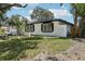 Charming single-story home with black shutters, manicured landscaping and mature trees at 641 Peachwood Dr, Altamonte Springs, FL 32714