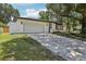 Charming one-story home with a two car garage, mature landscaping, and inviting curb appeal at 641 Peachwood Dr, Altamonte Springs, FL 32714