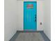 A close-up of a vibrant blue front door adding a pop of color to the home's exterior at 641 Peachwood Dr, Altamonte Springs, FL 32714