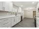Well-lit kitchen offers sleek countertops, stainless steel appliances, and convenient access to adjacent rooms at 641 Peachwood Dr, Altamonte Springs, FL 32714
