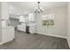 Charming kitchen featuring new appliances, white cabinets, eat-in area, and modern fixtures at 641 Peachwood Dr, Altamonte Springs, FL 32714