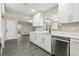 Updated kitchen with stainless steel appliances, white cabinetry, and modern fixtures for a sleek design at 641 Peachwood Dr, Altamonte Springs, FL 32714