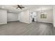 Open floor plan of the living room flowing into a modern kitchen with stainless steel appliances at 641 Peachwood Dr, Altamonte Springs, FL 32714