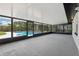 Enclosed patio provides a seamless transition to a refreshing pool, perfect for relaxation at 641 Peachwood Dr, Altamonte Springs, FL 32714