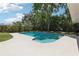 Inviting pool surrounded by lush greenery, perfect for relaxation and outdoor enjoyment at 641 Peachwood Dr, Altamonte Springs, FL 32714