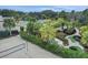 Aerial view showcasing a resort-style community with a pool, miniature golf, and sand volleyball court at 733 Longboat Dr, Davenport, FL 33896