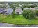 A sprawling backyard next to a pond and features a screened-in patio at 9942 Sweetleaf St, Orlando, FL 32827