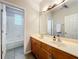 Bright bathroom featuring a double vanity and tub at 9942 Sweetleaf St, Orlando, FL 32827