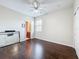 Unfurnished bedroom boasting hardwood floors, an en-suite bathroom, and a closet at 9942 Sweetleaf St, Orlando, FL 32827