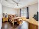 Cozy bedroom featuring a log-style bed, hardwood floors, and a ceiling fan at 9942 Sweetleaf St, Orlando, FL 32827