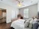 Bedroom featuring a light wood floor, ceiling fan, and double closets at 9942 Sweetleaf St, Orlando, FL 32827