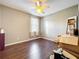 Unfurnished bedroom with hardwood floors, natural light, and ceiling fan at 9942 Sweetleaf St, Orlando, FL 32827