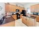 Spacious kitchen with granite countertops, wood cabinets and stainless steel appliances at 9942 Sweetleaf St, Orlando, FL 32827