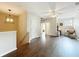 Upstairs living area with hardwood floors, neutral walls, and a cozy sitting area at 9942 Sweetleaf St, Orlando, FL 32827