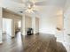 Spacious living room featuring hardwood floors, ceiling fan, and natural light at 9942 Sweetleaf St, Orlando, FL 32827