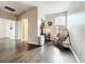 Bright room featuring dark wood floors, desk, and wicker chair near a window at 9942 Sweetleaf St, Orlando, FL 32827